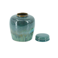 Round Ceramic Lidded Jar With Reactive Glaze And Subtle Ridges perspective