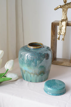 Round Ceramic Lidded Jar With Reactive Glaze And Subtle Ridges perspective